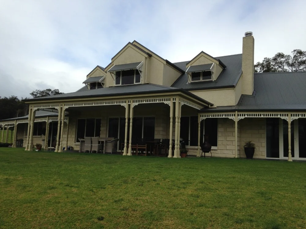 Two-storey homestead with a wraparound verandah
