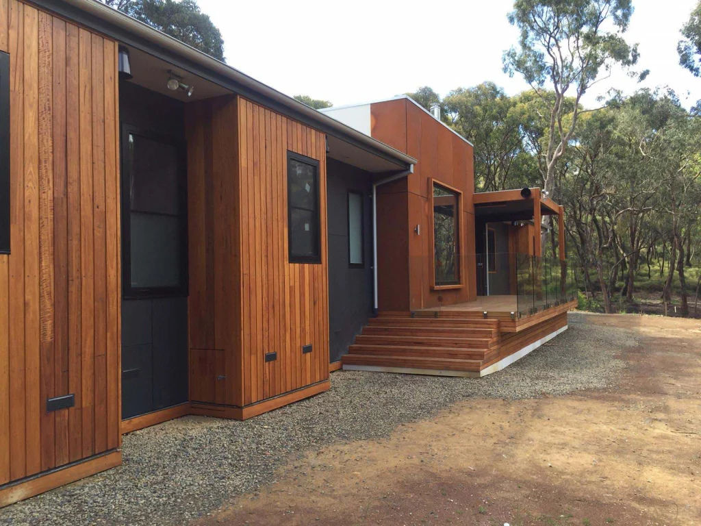 Contemporary home with timber and rust-toned cladding